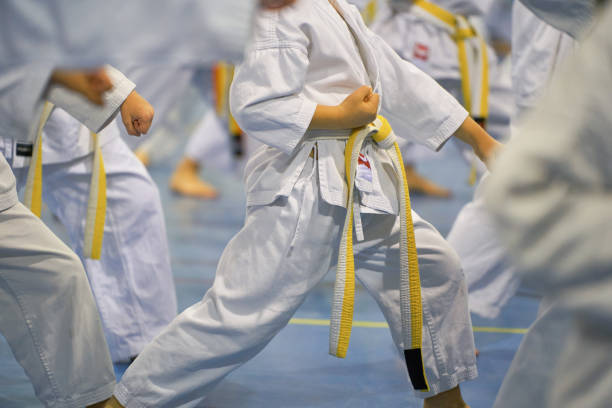 Karate practice with yellow belt in group training